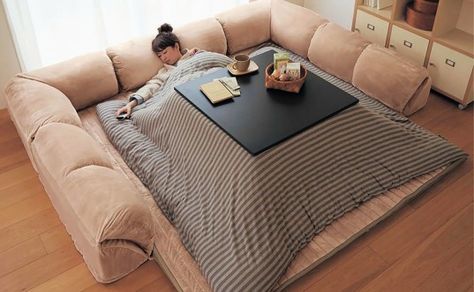 The Japanese Kotatsu is a hybrid table and bed with its own heat source that will keep you warm during even the coldest winters. Japanese Couch, Japanese Bed, Japanese Table, Inside A House, Design Japonais, Eco Friendly Furniture, Bed Table, Stay In Bed, Japanese House