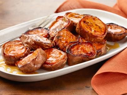 Roasted Sweet Potatoes with Honey and Cinnamon Recipe | Tyler Florence | Food Network Melting Sweet Potatoes, Good Sweet Potato Recipe, Thanksgiving Recipes Side Dishes, Thanksgiving Sides, Sweet Potato Casserole, Thanksgiving Side Dishes, Potato Dishes, Recipes Sweet, Sweet Potato Recipes