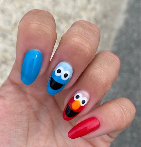 #elmo #cookiemonster #sesamestreet #rednaildesigns #bluenailart #nails #nailart #nailsofinstagram #naildesign #nailideas #nailartdesigns #gelnails Nails Cookie Monster, Elmo Nail Art, Elmo Nails Acrylic, Sesame Street Nails Acrylic, Easy Character Nails, Monster Truck Nails, Nail Character Designs, Elmo Nails Design, M&m Nails