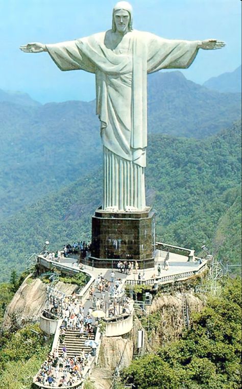 This giant image representing Jesus Christ has become one of the biggest postcards in Brazil and Rio de Janeiro. Being a symbol of Christianity in Brazil, in 2006 Christ the Redeemer was transformed into a Catholic sanctuary, the following year, in 2007, the monument was elected one of the seven wonders of the modern world. #brazil#riodejaneiro Christ The Redeemer Brazil, Brazil Travel Guide, Jesus Background, Christ The Redeemer Statue, Famous Monuments, Christ The Redeemer, Brazil Travel, Jesus Christ Images, Background Wallpaper For Photoshop