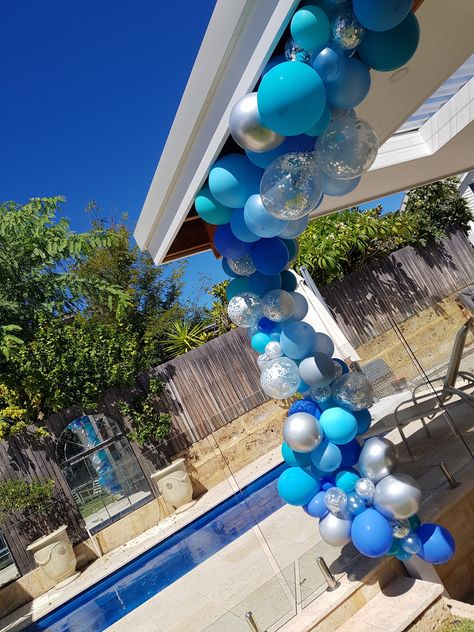 Blue and silver Balloon garland birthday Blue And Silver Balloon Garland, Balloon Garland Birthday, Silver Balloon Garland, Party Balloon Garland, Baby Shower Fishing, Garland Birthday, Tropical Garden Design, Pool Party Decorations, Silver Balloon