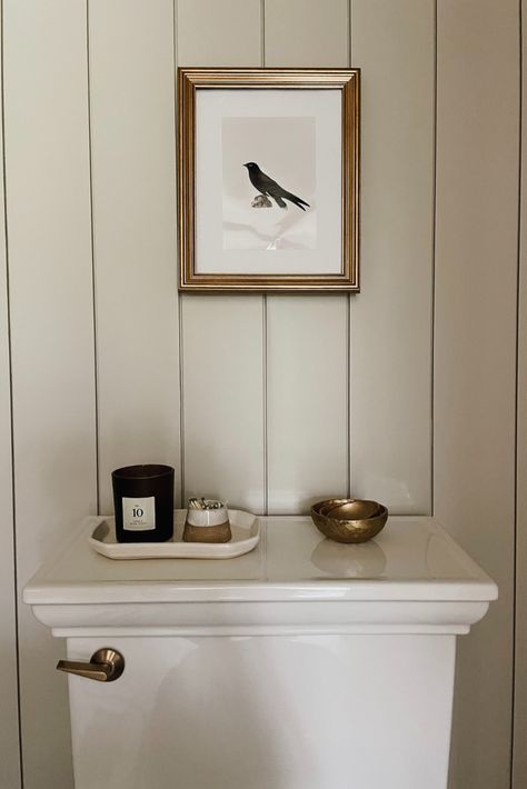 I’m so happy to share our main-floor powder room bathroom remodel, which has become one of my favorite home improvement projects so far! For our small bathroom makeover, we went with a classic, timeless, and traditional look, and I love how this simple bathroom design turned out. Click through for all the details on our bathroom paint color, floor tiles, décor, and more. DIY interiors bathroom, bathroom before and after. Powder Room All One Color, Small Bathroom Ideas Above Toilet, Half Bathroom With Wainscoting, Nickel Gap Bathroom Wall, Black And White Cottage Bathroom, Cheap Bathroom Wall Ideas, Historic Bathroom Ideas, Kate Moss Bathroom, Employee Bathroom Ideas