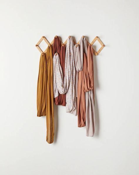 4 Organized Ways To Store Your Solly Wraps + Loops — Solly Baby Solly Wrap, Storage Ladder, Solly Baby Wrap, Yoga Mat Storage, Solly Baby, Earthy Hues, Kid Hacks, Baby Wrap, Baby Wraps