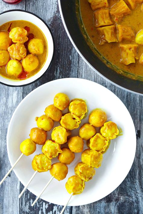 Hong Kong Curry Fish Balls is a classic street food snack that boasts a delicious, spicy and fragrant curry sauce! It's easy to make, and can be enjoyed street food style on wooden skewers, in a bowl drizzled with plenty of chili oil, or over steamed rice or noodles! #thatspicychick #curryfishballs #hongkongcurryfishballs #cantonesefood #appetizer #snack #streetfood #hongkongfood #easyrecipes | That Spicy Chick Curry Fish Balls, Curry Fish, Fish Balls, Wooden Skewers, Cantonese Food, Hong Kong Food, Fish Ball, Food Snack, Curry Sauce