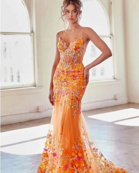 Still Available 🧡Such a unique dress!! We love this vibrant orange formal gown. This dress features fuchsia, yellow and orange flowers throughout. Mermaid fit with plenty of room to walk comfortably. The open back is just as stunning as the front. Sheer corset front with a double strap. 🧡🩷💛Size 6 Just $399 Orange Mermaid, Orange Prom Dresses, Floral Print Gowns, Cinderella Divine, Printed Gowns, Corset Bodice, Backless Prom Dresses, Prom Girl, Stunning Gowns