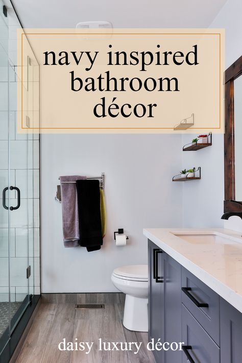 Here are some stylish ways to incorporate navy blue into your bathroom design at home, adding depth and texture in the process. Accessories For Navy Bathroom, Navy Blue Restroom Decor, Navy Bathroom Accessories, Blue Bathroom Accents, Navy Blue Bathroom Accessories, Navy Blue Bathroom Vanity Wood Mirror, Navy Blue Nathroom Cabinets, Navy Blue Bathroom, Curtains To Go