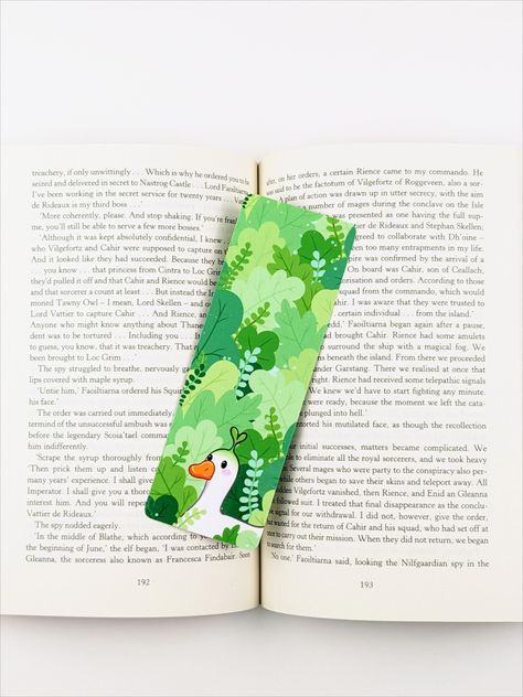 Double sided laminated handmade bookmark. A kawaii white duck standing in a leafy green forest. He has a little green sprout coming out of the top of his head. Duck Bookmark, Bookmark Inspiration, Sprout Bookmark, Nature Bookmark, Kawaii Cottagecore, Duck Crafts, Cottagecore Gifts, Nature Bookmarks, Bookmark Ideas