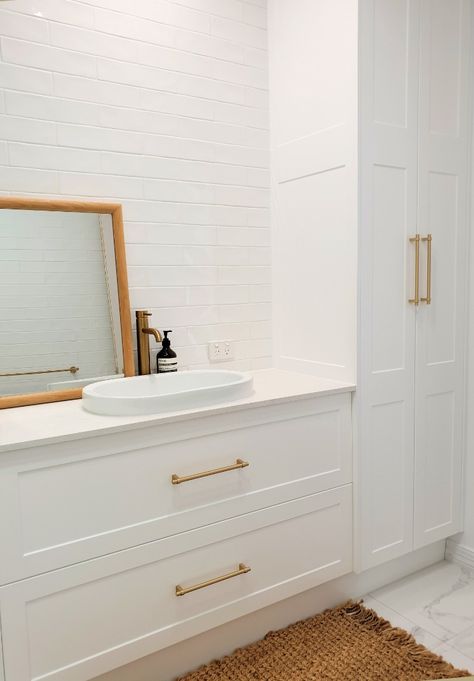 love our Shaker Lucca with the brass handles and tapware sitting alongside our shaker linen tower with White Truffle stone top and an oval inset basin
#classiquekitchens_vanities #bathroom #whitebathroom #shakerbathroom #hamptonstyle #hamptonsbathroom #shakercabinets #qldhomes #brisbanebathrooms Bathroom Vanity Ideas White Cabinets, Vanity And Cabinet Combo, Vanity Handles Bathroom, Vanity Linen Cabinet, Bathroom Vanity Linen Cabinet, Vanity Linen Tower, Bathroom Vanity With Built In Linen Cabinet, Linen Cabinet Next To Vanity, Bathroom Vanities With Drawers