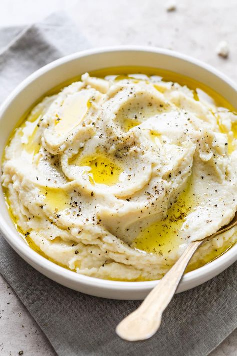 This recipe for the creamiest Mashed Cauliflower is thick and creamy without any cheese or sour cream! A delightful side dish that is a perfect low carb swap for traditional mashed potatoes. With a slightly sweet and nutty flavor, and absolutely luscious texture, this recipe is sure to be a hit. Ready in 30 minutes. Whole30, paleo, gluten free, and with a vegan option. Best Mashed Potatoes Recipe, Best Mashed Potatoes Ever, Olive Oil Mashed Potatoes, Creamy Mashed Potatoes Recipe, Creamy Mashed Cauliflower, Fluffy Mashed Potatoes, Easy Whole 30 Recipes, Cauliflower Mashed Potatoes, Best Mashed Potatoes