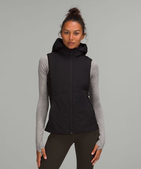 Running in the cold never felt so good. This insulated vest will protect you from the elements with stretchy, water-repellent tech fleece fabric placed where you need to move. Designed for Running. Slim fit skims your body. Removable dickie zips into inside of vest. Zippered exterior pockets with a hidden phone sleeve. Reflective details. Water-Repellent, GlydeTM Fabric. Lululemon Vest, Running In Cold Weather, Technical Clothing, Vest Designs, Outerwear Vest, Lulu Lemon, Lululemon Women, Workout Outfit, Athletic Apparel