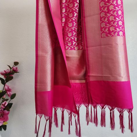 Color: Rani Pink Beautiful Indian katan silk dupatta with golden handweaving. The intricate floral handwoven design adds an incredibly royal and elegant look. The design on this Indian dupatta/stole is inspired by the vintage raw silk Indian dresses. The fabric is organically rich and luxurious to feel and is one of a kind. This dupatta can be paired with simple as well as designer outfits. You can wear it with gold jewelry or matching jewelry to complete the traditional Indian look. You would look beautiful wearing this on several occasions ranging from weddings to festivities such as Durga puja, Diwali, Eid and other celebrations.   The authenticity of each item of our shop is ensured every time as we bring this to you directly from the hundreds of artisans taking this legacy of Banarasi Rani Pink Dupatta, Banarsi Dupatta, Indian Dupatta, Designer Dupatta, Pink Dupatta, Rani Pink, Katan Silk, Durga Puja, Matching Jewelry