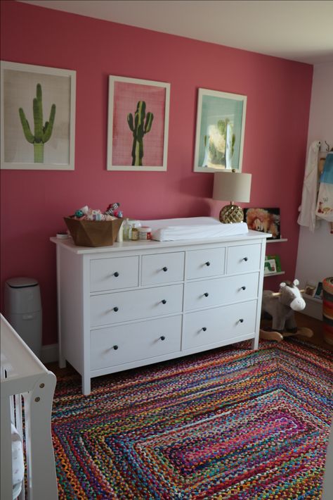 Mexican decor nursery. Pink wall, cactus prints, Ikea dresser, crib Book corner. Baby decor Pink Cactus Nursery, Mexican Style Nursery, Bright Pink Nursery Ideas, Mexican Nursery Theme, Mexican Themed Nursery, Mexican Nursery Decor, Mexico Nursery, Hot Pink Nursery, Bright Pink Nursery