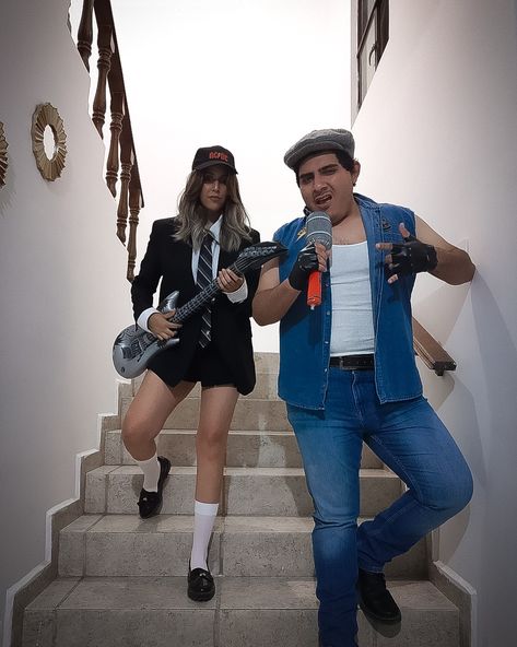 Angus young & Brian Johnson Halloween costume 80s Singers Costume, Classic Rock Halloween Costumes, Through The Decades Costume Ideas, Acdc Costume Halloween, Rock Couple Costume, Music Artist Halloween Costumes, Rock Singer Outfit, Acdc Costume, Rock Theme Party Outfit