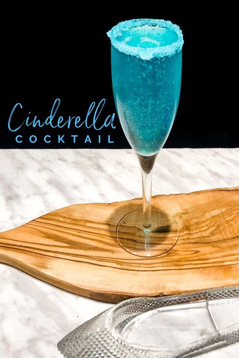 This Glass slipper Disney inspired Cinderella cocktail is perfect for any party or Royal ball! Adults will love this sparkly Dirty Cinderella cocktail and it is so easy to make with only 4 ingredients. If you love Champagne cocktails then you will love the Cinderella! Drink With Champagne, Cinderella Cocktail, Blue Cocktail Recipes, Tequila Sunrise Recipe, Princess Drinks, Blue Lagoon Cocktail, Disney Inspired Cocktails, Disney Cocktails, Rainbow Cocktail