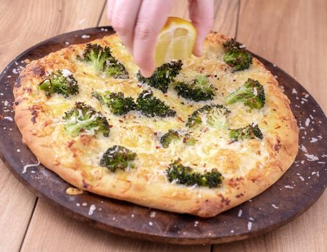 Lemon and broccoli white pizza uses olive oil, garlic and cheese as it’s base. The acidity from the lemon juice really brightens up this cheesy pizza without being overly lemony. The three cheese combination gives you a melty but flavorful base with crunchy broccoli. Brocolli Pizza, Lemon Chicken Broccoli, Broccoli Pizza, Crunchy Broccoli, Cheesy Pizza, Olive Oil Garlic, White Pizza, Pizza Ingredients, Vegetarian Pizza