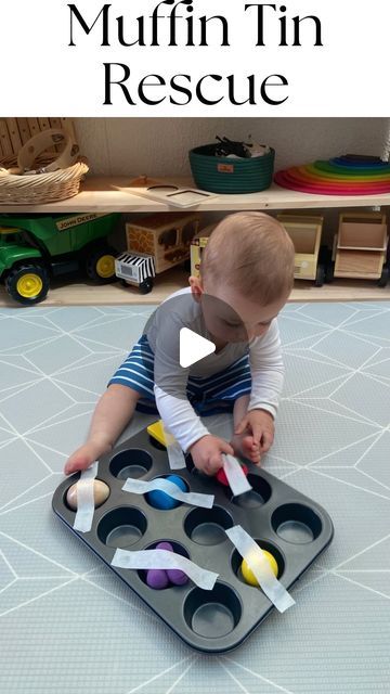 Anthea | EST. 2022 on Instagram: "•MUFFIN TIN RESCUE•  Grab your baby or toddlers favourite toys and place them into a muffin tin.  Then cover them with some masking tape.   Let your baby/toddler explore the masking tape and discover what’s underneath.   This experience allows your child to develop their… - Fine motor skills - Gross motor skills - Hand-eye coordination  - Concentration  Will you give a go? • • • #muffintinrescue #play #shelfie  #playroom #playroomtoys  #playroomideas #playroomdecore #playroomorganization  #playroomgoals #learningathome #learningideas #earlyyears #earlylearningplay" Infant Sensory, Baby Muffins, Infant Sensory Activities, Gross Motor Activity, Playroom Organization, Baby Sensory, Gross Motor, Gross Motor Skills, Motor Activities