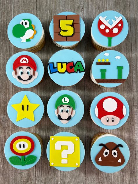 12 Super Mario Bros edible fondant cupcake toppers. Each topper is approx 2.5” and fits perfectly on a cupcake. Dress up your homemade or store bought cupcakes! Substitutions available upon request including Bowser & Princess Peach. This set includes Mario, Luigi, Yoshi, Toad, Goomba, Piranha, Fire Flower, Star, Question block, Game screen, Nameand Age Block. Mario Theme Cupcakes, Mario Birthday Cupcakes, Fondant Mario, Mario Cupcake Toppers, Toad Mario Bros, Mario Cupcakes, Super Mario Cupcakes, Super Mario Bros Party Ideas, Superhero Cupcake Toppers