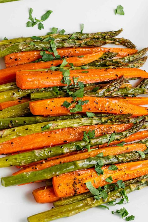 Roasting carrots and asparagus together in the oven is quick and delicious! This recipe is an easy side dish that pairs with array of dishes. Serve the vegetables with lemon wedges and grated parmesan. Roasted Carrots And Asparagus, Easy Roasted Carrots, Asparagus In The Oven, Carrots And Asparagus, Asparagus Recipes, Baked Asparagus, Roasted Vegetable Recipes, Cooked Carrots, Roasted Vegetable