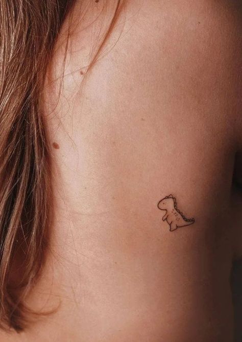 Trex Mini Tattoo, Small Matching Dinosaur Tattoos, Dainasor Tattoo, Single Line Dinosaur Tattoo, Fine Line Tattoo Dinosaur, Trex Cute Tattoo, Mini Skeleton Tattoo, Cute Trex Tattoo Ideas, Dinsors Tattoo