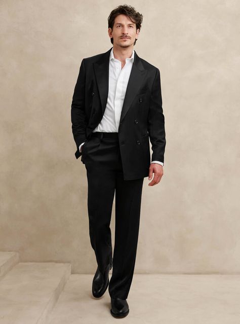 Elevate your formal attire with a sophisticated black double-breasted suit paired with a white dress shirt and sleek black Chelsea boots. A simple and flawless ensemble that blends timeless elegance with contemporary flair. Black Formal Wear Men, Black Suit Men Outfit, Ceremony Outfit Men, Men Black Tie Wedding Guest Attire, Black And White Gala Outfit, Man Formal Outfit, Formal Mens Fashion Wedding, Black Suit No Tie, Black Suit Outfit Men