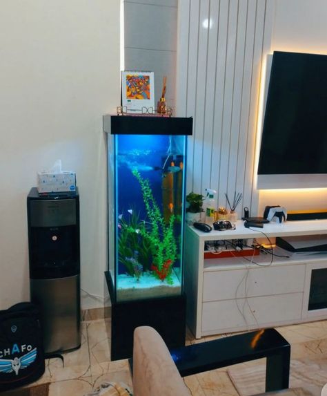 Vertical Aquarium, Fish Aquarium Ideas For Living Room, Aquarium Fish Tank Living Rooms, Tv Unit With Aquarium Design, Interior Design Fish Tank, Aquarium Under Tv, Living Room Partition Design With Fish Tank, Home Tv Wall Aquarium, Aquarium In Hall