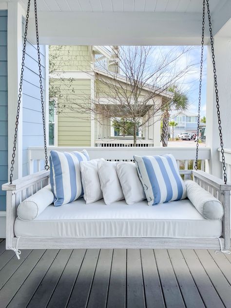 Hola Beaches 30A Progress Pics // Our front porch at the 30A rental property with a white porch swing and blue striped cushions! Blue And White Home Exterior, White House Porch, Coastal Front Porch, Beach House Front Porch, Beach House Porch, Hola Beaches, White Porch, Front Porch Swing, Porch Swing Bed