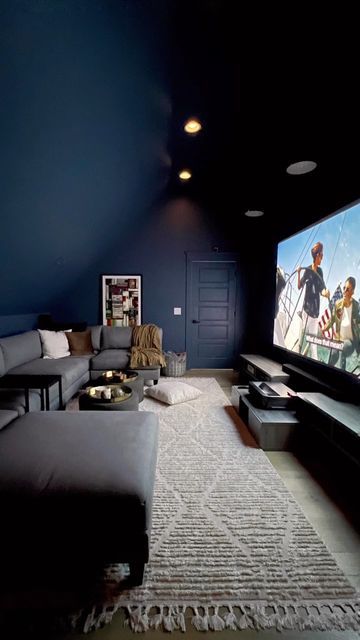 Snug Cinema Room Ideas, Loft Ideas Upstairs Media Room, Movie Rooms In House Cozy, Blue Cinema Room, Navy Blue Theater Room, Navy Blue Movie Room, Basement Movie Room Paint Colors, Dark Blue Media Room, Dark Blue Cinema Room