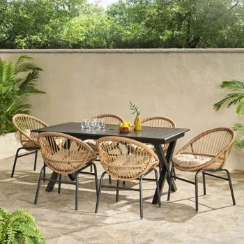 Red Barrel Studio® Rumbrook Outdoor Outdoor Wicker And Aluminum 7 Piece Dining Set With Cushion | Wayfair Round Dining Table Decor, Earthy Design, Outdoor Meals, Boho Patio, Outdoor Spa, 7 Piece Dining Set, Wicker Chairs, Aluminum Table, Noble House