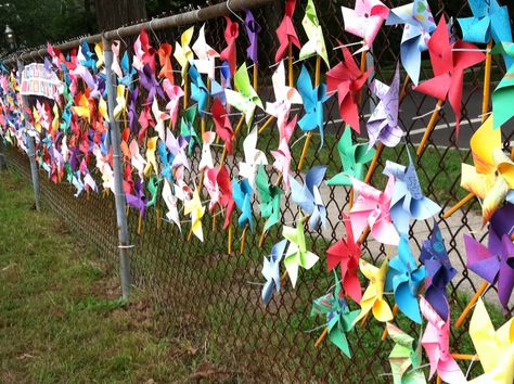 PINWHEELS FOR PEACE | Pinwheels For Peace, Peace Activities, Fence Weaving, Peace Garden, Group Art Projects, Kindness Projects, Collaborative Art Projects, International Day Of Peace, School Murals