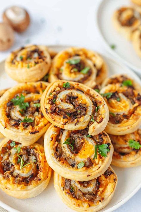 These Vegan Puff Pastry Pinwheels loaded with savoury mushrooms and gooey vegan cheese are the perfect finger-food party appetizers. They're great for any holiday season, gatherings or parties when your friends are coming over. Vegetarian Potstickers Recipe, Mushroom Puff Pastry, Fall Finger Foods, Vegan Puff Pastry, Mushroom And Cheese, Mashed Potato Bites, Pastry Pinwheels, Vegan Finger Foods, Puff Pastry Pinwheels