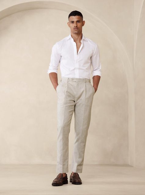 Polished and professional look with a timeless white dress shirt, sophisticated beige pleated pants, and elegant dark brown loafers. Ideal for a refined ensemble that balances classic style with modern elegance. Mens Wedding Guest Outfit, Wedding Guest Outfit Men, Wedding Guest Men, Linen Pants Suit, Beach Formal, Cocktail Attire Men, Formal Wedding Attire, Party Outfit Men, Rehearsal Dinner Outfits