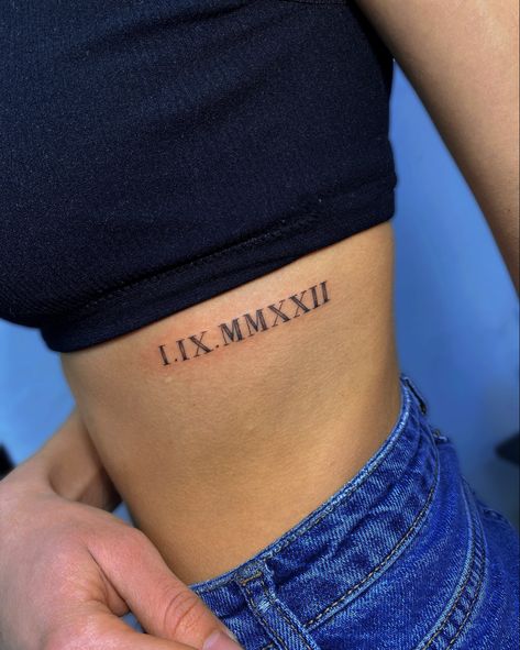 Ribcage Roman Numeral Tattoo, Date Of Birth Tattoos Ideas Roman Numerals, Roman Numeral Tattoo Ribcage, Collarbone Tattoo Roman Numerals, Roman Numerals Rib Tattoo, Rib Tattoo Roman Numeral, Roman Numeral Tattoo On Ribs, Roman Numeral Tattoo Font Style, Roman Numeral Tattoos Women