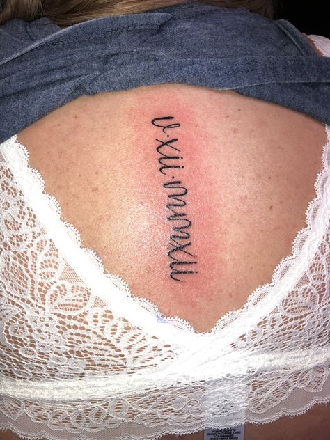 Cursive Roman Numerals Spine tattoo!! #weddingdate #spinetattoo #femininetattoo Roman Numeral Tattoo Cursive, Roman Numeral Cursive Tattoo, Feminine Roman Numeral Tattoo Font, Lettering Spine Tattoo, Roman Numeral Spine Tattoo, Cursive Roman Numeral Tattoo, Slime Tattoo, Roman Numeral Tattoo Font, Anniversary Tattoos