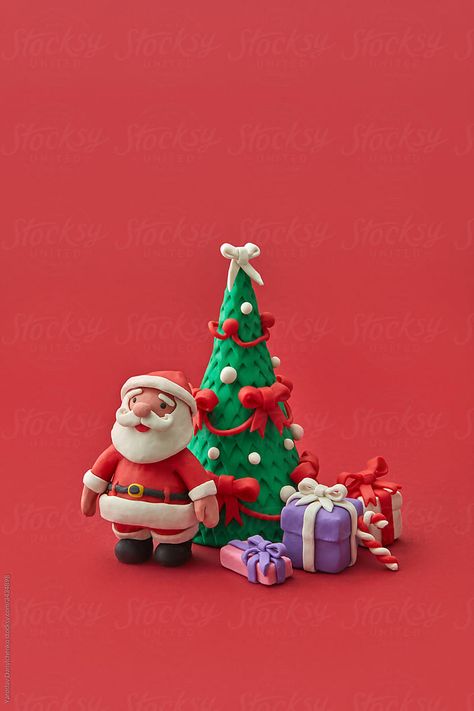 Craft Christmas set made from multicolored modeling clay or plasticine figures of fir tree, Santa Claus and different present boxes on a red background, copy space. Christmas decoration concept. Plasticine Figures, Clay Santa Claus, Clay Santa, Space Christmas, Art Examples, Tree Santa, Clay Crafts For Kids, Craft Christmas, Christmas Set