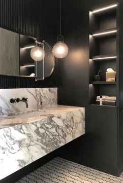 Design Crush: Floating Marble Sinks & Vanities | The Savvy Heart | Interior Design, Décor, and DIY Marble Floating Vanity, Floating Marble Vanity, Floating Marble Sink, Black Sconces, Powder Room Design, Marble Vanity, Marble Sinks, Globe Pendant Light, Floating Vanity