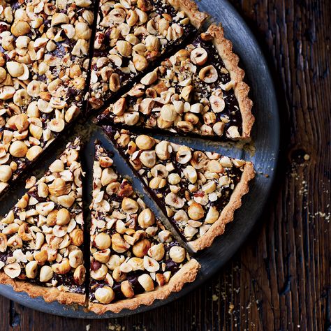 This indulgent, impressive chocolate tart is made with a hazelnut crust and a bittersweet-chocolate ganache filling. Hazelnut Tart, Hazelnut Recipes, Mothers Day Desserts, Chocolate Ganache Filling, Caramel Tart, Wine Magazine, Desserts Chocolate, French Desserts, Tart Recipe