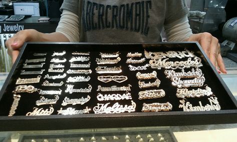 Nameplate necklace display at Slauson Swap meet in Los Angeles. Custom Gold Jewelry, Xoxo Jewelry, Swap Meet, Expensive Jewelry Luxury, Exotic Nails, Nameplate Necklace, Gold Name Necklace, Necklace Display, Dope Jewelry