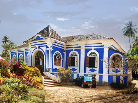 Casa Robello, Anjuna, Goa, Built in 16th Century. This royal blue Goan house is classic due to its characteristic balconies. The seats along the length of the porch are L-shaped and made from expensive wood. The windows have brightly coloured stained glass and contrasting it are lightly tinted flint glass that are no longer made in such a creative manner Goa Portuguese, Portuguese Houses, Goa Travel, Casas Coloniales, Traditional Houses, Colonial Architecture, Indian Architecture, Grand Staircase, Colonial House