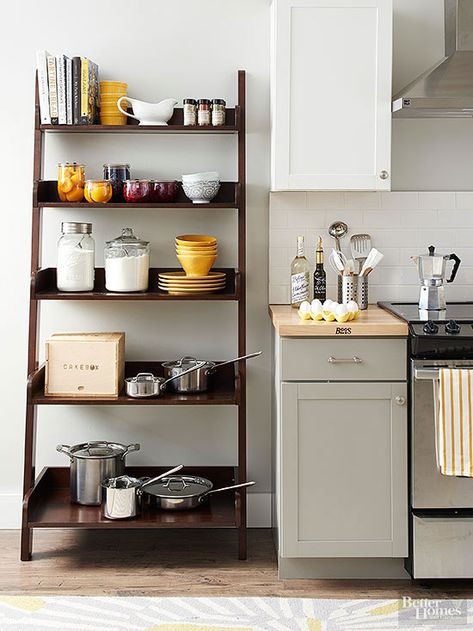 Buy a readymade bookcase and place it where you need a pantry. This ladder-like case features shelves that get wider and deeper toward the unit's base, which amps up its ability to store items of diverse size. Organiser Cucina, Microwave Shelf, Kitchen Storage Ideas, Affordable Storage, Small Kitchen Storage, Diy Kitchen Storage, Kitchen Storage Solutions, Laundry Room Storage, Kitchen Decorating