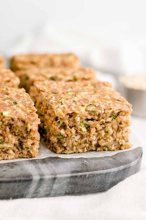 Healthy Zucchini Oatmeal Snack Cake - only 96 calories & SO easy to make! Even my picky eater loves it & asks for it all the time! We eat it for breakfast too. SO good! ♡ clean eating healthy snack cake. healthy snack cake under 100 calories. greek yogurt healthy snack cake. healthy zucchini cake recipe. healthy snack easy to make. #healthyrecipes Healthy Zucchini Cake, Healthy Yogurt Snacks, Zucchini Cake Healthy, Oatmeal Snack, Zucchini Cake Recipe, Oatmeal Snacks, Zucchini Oatmeal, Zucchini Cakes Recipe, Breakfast Oats