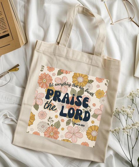 let everything that has breath praise the Lord retro tote bag This 100% cotton bag comes in one size - 15" x 16"- perfect for everyday wear.  .: 100% cotton canvas .: Heavy fabric (12 oz/yd² (406.9 g/m .: Sewn-in label Bible Canvas Bag Painting Ideas, Bible Verse Tote Bag Painting, Bible Bags Totes Diy, Christian Tote Bag Design, Cricut Bags, Bible Study Crafts, Bible Tote Bag, Tote Bag Christian, Christian Tote Bags