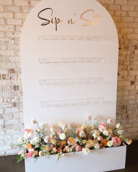 Elevate your event with our stunning champagne wall! 🥂✨ This eye-catching display is perfect for weddings, birthdays, and other celebrations. Holds 32 stemmed glasses and features customizable wording and floral design. Visit our website for more details: www.bloomandivyweddings.com. #whereflowersbloomsodoeshope #champagewall #events #northgeorgiaweddings #weddingcoordinating #weddingflorals #eventplanner Drink Display Wedding, Drink Display, Champagne Wedding, Co Ord, Champagne, Floral Wedding, Floral Design, Celebrities, Wall