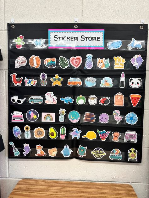 Pocket chart with prize stickers. Incentives For Elementary Students, 3rd Grade Incentives, Sticker Store Classroom Middle School, Sticker Shop Classroom, Sticker Rewards Classroom, Elementary Prize Box Ideas, Classroom Incentives Kindergarten, Class Sticker Store, Sticker Reward System