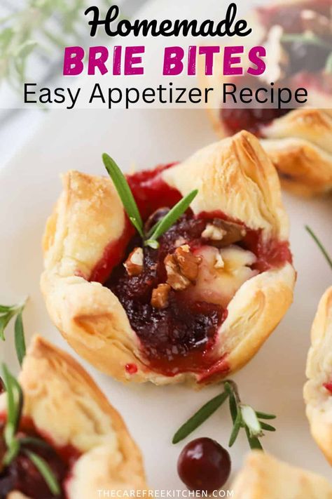 These Cranberry Baked Brie Bites are a quick and easy bite-size appetizer to serve at your next holiday get together. Each phyllo dough cup is full of melted Brie cheese, cranberry sauce, toasted pecans, and topped with a tiny sprig of fresh rosemary. #thecarefreekitchen #appetizer #brie #cheese #phyllo #pastry #holidays #cranberry #pecan Brie Cheese Appetizer Recipes, What To Do With Brie Cheese, Holiday Brie Bites, Brie And Phyllo Dough, Cranberry Pecan Brie Bites, Apple Brie Bites, Brie Phyllo Appetizer, Bri Appetizer, Phyllo Dough Brie Recipes