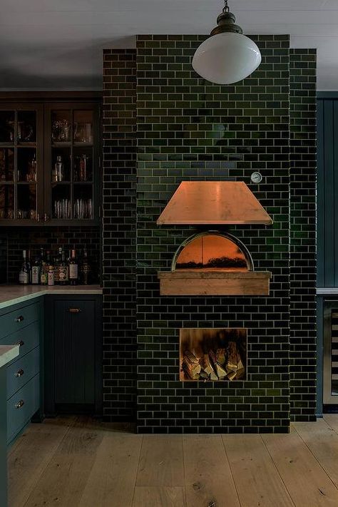 A black subway tiled pizza oven is finished with a copper hood. Outdoor Pizza Oven Kits, Pizza Oven Fireplace, Kitchen Canopy, Black Subway Tiles, Wood Burning Pizza Oven, Copper Hood, Brick Oven Pizza, Brick Pizza Oven, Wood Oven