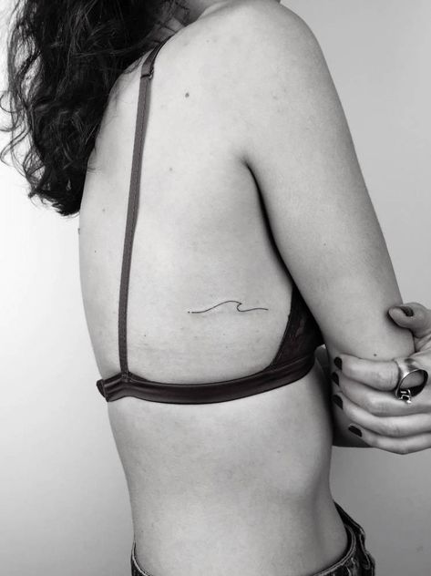 Tiny Micro Tattoos You Can Get Inked in 1 Minute Wave Tattoo Ribcage, Wave Tattoo Minimalist, Minimalist Anchor Tattoo, Whale Tail Tattoo, Tattoo Wave, Tail Tattoo, Prince Tattoo, Small Rib Tattoos, Wave Tattoo