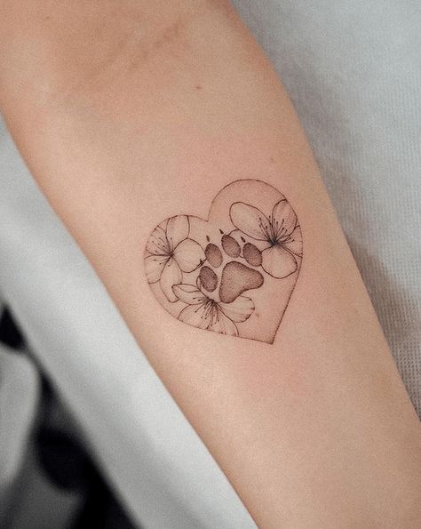 65 Meaningful Paw Print Tattoos for Pet Lovers - The Beauty Pursuit Paw Print In Heart Tattoo, Fine Line Dog Paw Print Tattoo, Daisy Dog Tattoo, Flower Paw Print Tattoo, Pets Tattoo Ideas, Cat Paw Tattoos, Dog Memorial Tattoos, Pawprint Tattoo, Dog Paw Tattoo