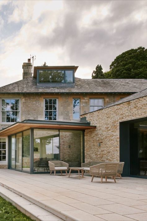 slim framed sliding glass doors in a modern extension in Yorkshire Glass Wall Extension, Modern Extensions To Old Houses, Kitchen In Glass Extension, Modern Extension To Old House, Glass Extension House, Old And New House Extension, Australian House Extension, Stone House Extension, Farmhouse Glass Extension