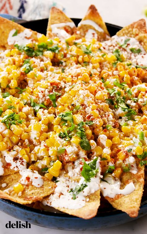 Mexican Street Corn Nachos taste even better than they look. Get the recipe at Delish.com. #recipe #easy #easyrecipes #delish #mexican #corn #nachos #apps #appetizer #cheese #chips #gameday #party #partyideas #partyfood Street Corn Nachos, Corn Nachos, Cheese Nachos, Street Corn, Mexican Street, Think Food, Clean Eating Snacks, Nachos, I Love Food