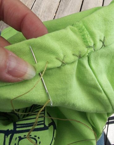 How to Alter a T-Shirt How To Alter The Neckline Of A Tshirt, Altering T Shirts Neckline, Tee Shirt Neckline Alterations, How To Hem A Tee Shirt, T Shirt Neckline Alteration Diy, How To Alter A T Shirt Neckline, Shorten Tshirt Sleeve, Altering T Shirts, How To Hem A T Shirt